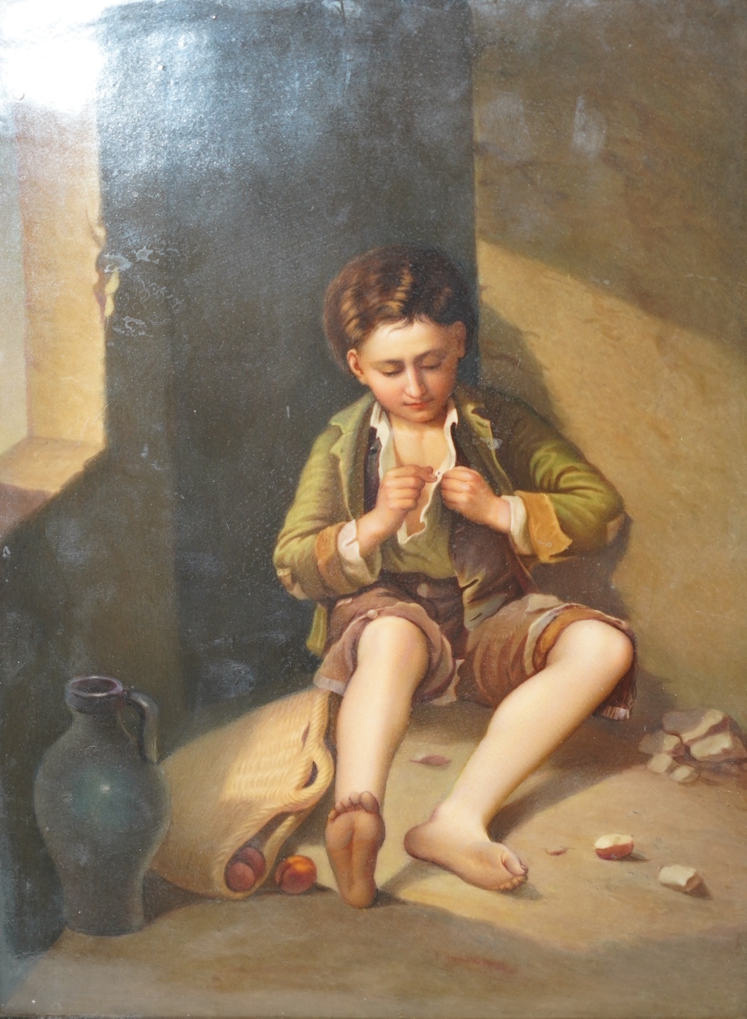 A KPM Berlin porcelain plaque, painted with a young beggar after Murillo, 18.5cm wide, 25cm high. Condition - good